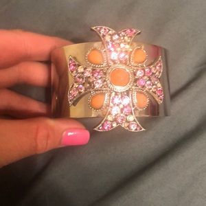 Silver cuff bracelet with pink and orange cross
